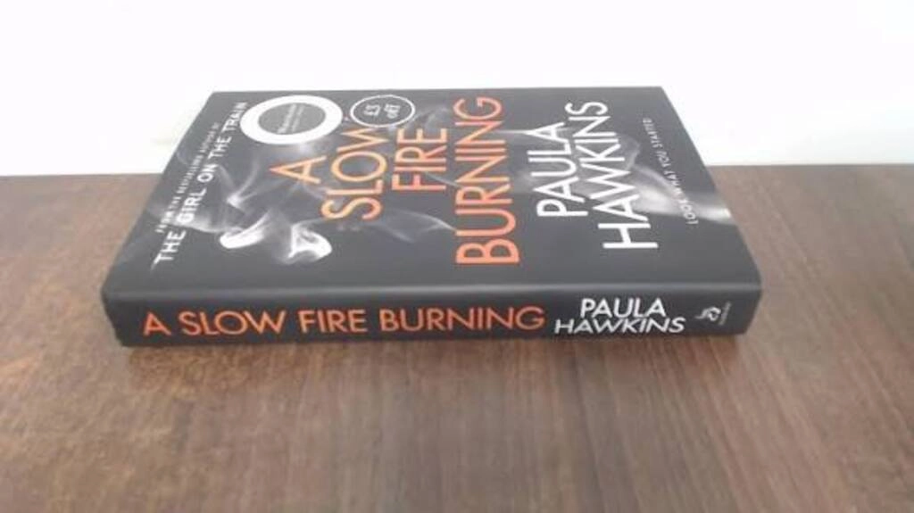 a slow fire burning (used,hard cover,good condition)